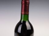 a bottle of wine that is sitting on a table
