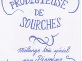 embroidered tea towel with the words, ' terre rodieuse de sourches ' and a rose on it