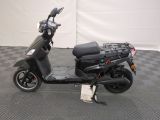 a scooter with a basket on the back of it