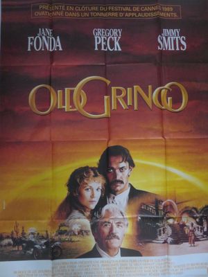une vieille affiche de cinéma représentant un homme et une femme devant un coucher de soleil