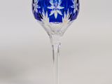 a blue wine glass with a snowflake design on it