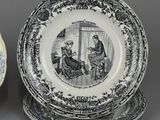 two black and white plates with a picture of a man and a woman on them