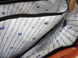 a close up of a handbag with a zipper on it