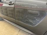 a close up of a car ' s door handle and door handle