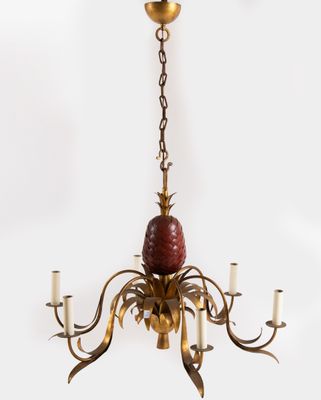 an image of a chandelier with a pineapple hanging from the ceiling