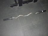 a bar that is sitting on the floor next to a bench