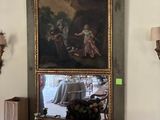 un tableau accroché au mur au-dessus d'une table sur laquelle se trouve une corbeille de fruits