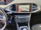 the dashboard of a car with a gps device in the center