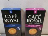 two boxes of cafe royal coffee sitting on a counter