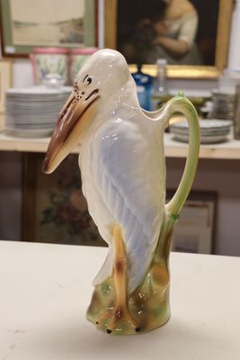 a bird that is sitting on top of a vase