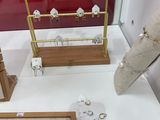 a display of jewelry on display in a glass case