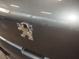 a close up of a car badge on the front of a car