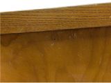 a close up of a wooden table with a white background