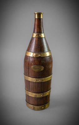an image of a wooden wine bottle with brass trims