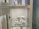 a display case with a lot of jewelry inside of it