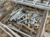 a crate full of bolts and screws sitting on the ground