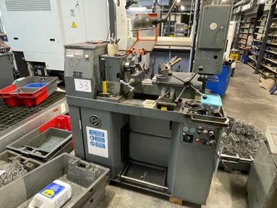 a picture of a machine in a factory with a lot of tools
