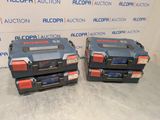 two blue and red tool boxes sitting on top of a table