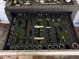 a tool tray with many tools in it on the floor
