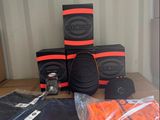 many boxes of orange and black items on a table