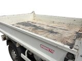 a white truck with a flat bed on the back of it
