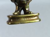 a bronze statue of an elephant on a pedestal