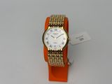 an image of a gold and white wrist watch on an orange bracelet