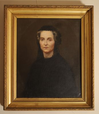 a painting of a woman in a black dress is hanging on a wall