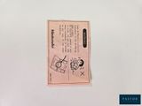 a small piece of paper with a drawing of a person on it