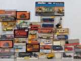 many different types of toy trains and trucks on display