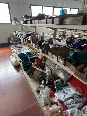 many boxes of clothing on the shelves in the room