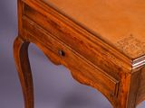 an image of a small wooden table with a leather top