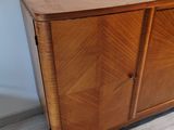 an image of a wooden cabinet in the corner of a room
