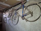 a bike hanging on a wall in a garage