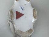 a white plate with a red triangle on it