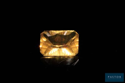 a yellow diamond on a black background