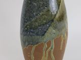 a brown and green vase with a number on it