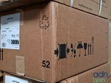 boxes stacked on top of each other on a shelf in a warehouse