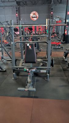 a picture of a gym with a lot of equipment