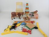 a pile of wooden toys on a white surface