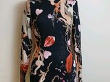 a close up of a dress on a mannequin on a mannequin stand