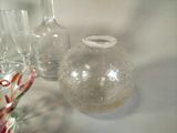 bottles and glasses are sitting on a table with a white background