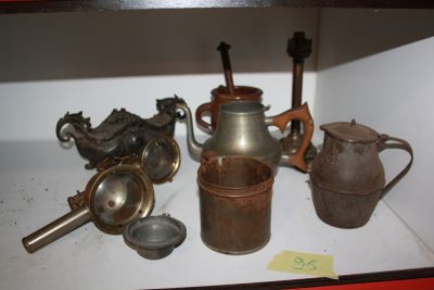 a shelf that has a lot of old items on it