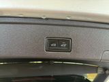 a close up of a car ' s dashboard with a button