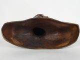 a close up of a brown object on a white surface