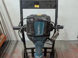 an image of a drill on a stand in a room