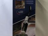 a close up of a box of a vacuum cleaner on a white surface