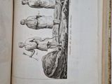 an open book with a drawing of a man and a woman on it