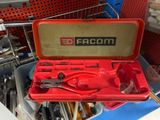 a red tool box with tools inside of it