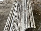 a wooden bench sitting in the middle of a yard